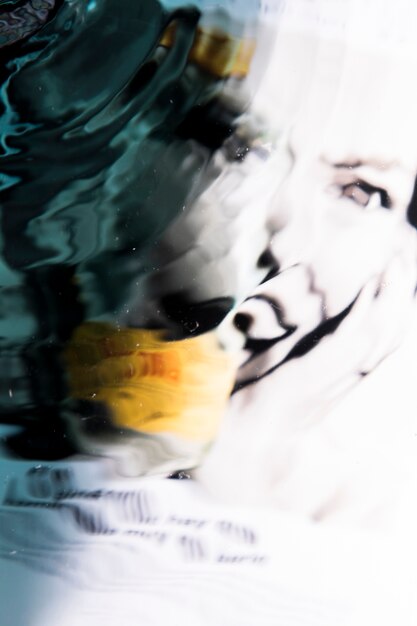Abstract face of a woman in water waves