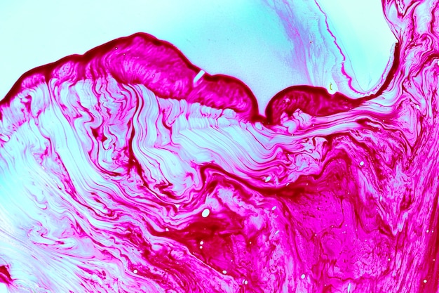 Abstract fluid violet shapes in oil