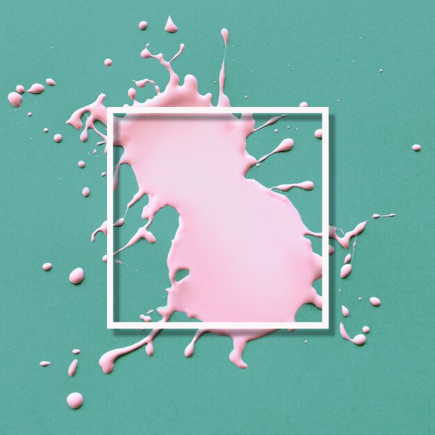 Abstract frame with pink splatter on green 