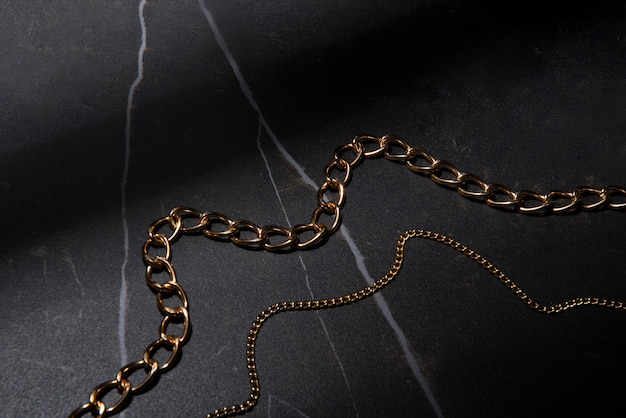 Free photo abstract gold chain jewellery presentation