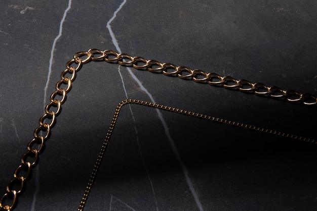 Abstract gold chain jewellery presentation