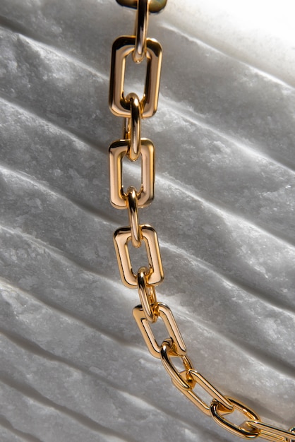 Abstract gold chain jewellery presentation