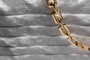 Free photo abstract gold chain jewellery presentation