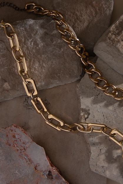 Abstract gold chain jewellery presentation