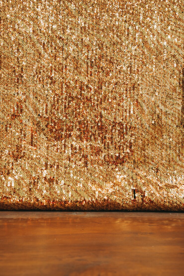 Free Photo abstract golden glitter backdrop on wooden desk