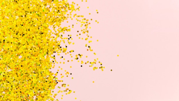 Abstract golden glitter on pink background