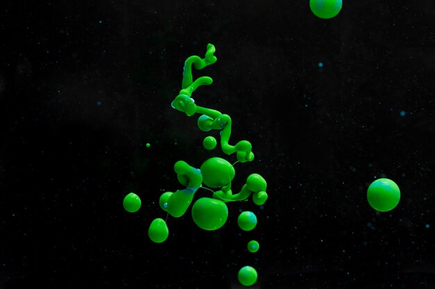 Abstract green acrylic shapes on black background