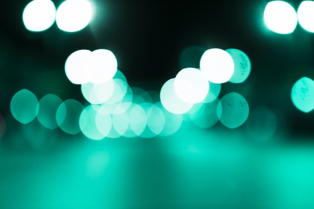 Free photo abstract green bokeh illuminated background