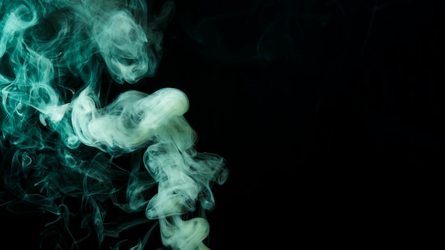 Abstract green smoke move on black background