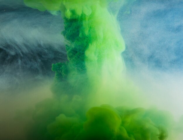 Abstract heavy green cloud between light haze