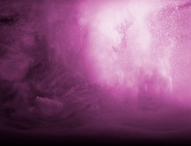 Free photo abstract heavy purple smoke in dark liquid