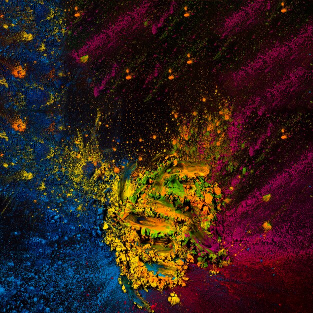 Abstract holi powder spotted over black surface