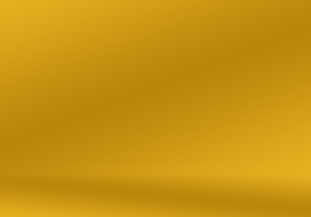 Free photo abstract luxury gold yellow gradient studio wall, well use as background,layout,banner and product presentation.