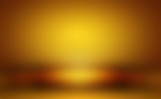Бесплатное фото Абстрактная роскошная золотисто-желтая градиентная стена студии хорошо используется в качестве фонового баннера и презентации продукта