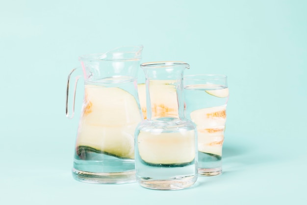 Abstract melon shapes on glasses of water