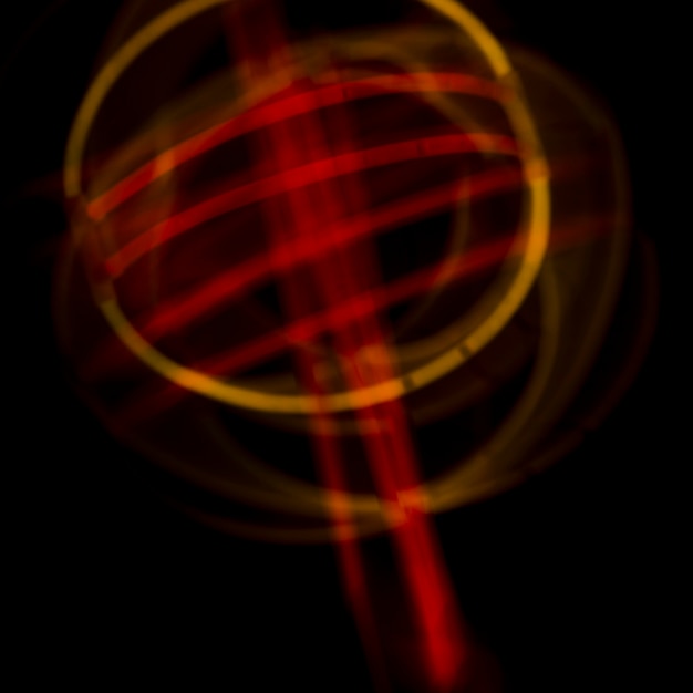 Foto gratuita disegno curvo luci al neon astratte su sfondo scuro