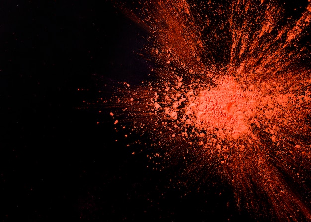 Free photo abstract orange powder splatted background