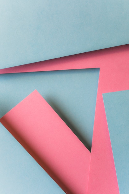 抽象的なピンクとグレーの紙の幾何学的形状の背景