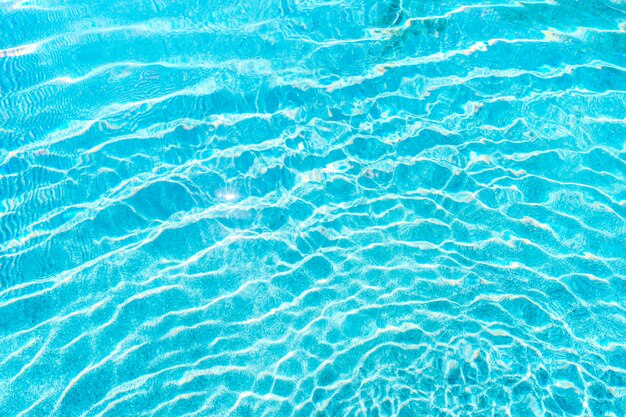 Abstract pool water surface and background with sun light reflection