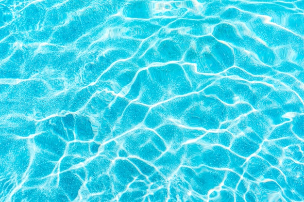 Abstract pool water surface and background with sun light reflection