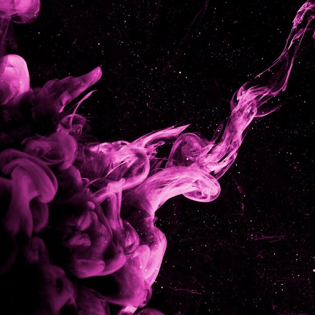 Abstract purple haze in dark liquid
