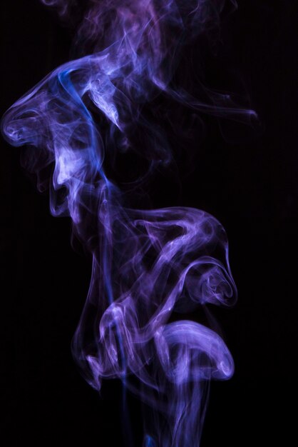 Abstract purple vaporizers fragrant steam over black backdrop