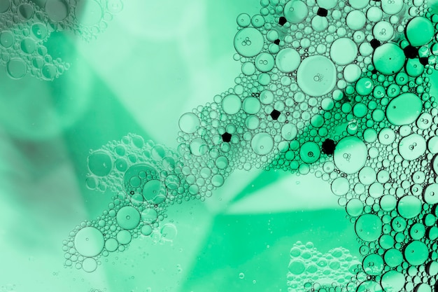 Free photo abstract pyramid with bubbles in green