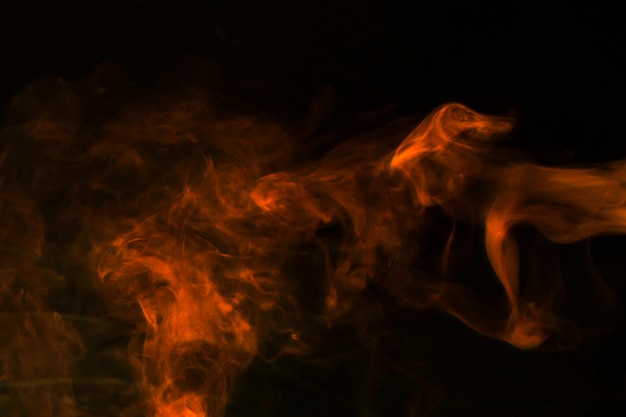 Abstract red smoke on black backdrop