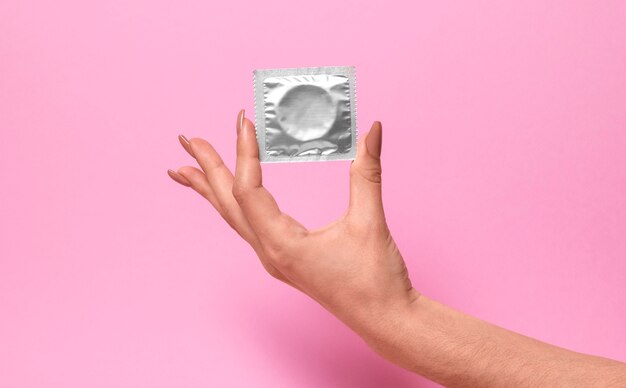 Abstract sexual health composition with condom