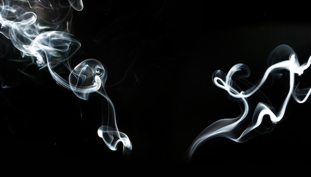 Abstract smoke silhouettes on black background