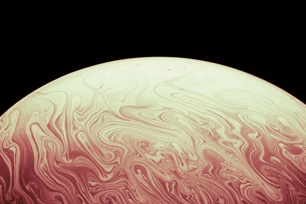 Abstract smooth soap bubble on black background
