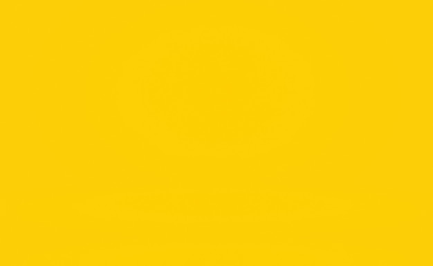 Abstract solid of shining yellow gradient studio wall room background.