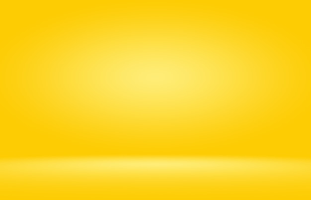 Free photo abstract solid of shining yellow gradient studio wall room background.