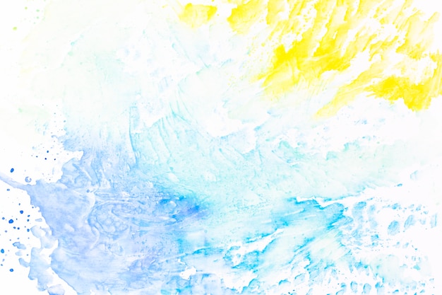 Abstract splashes of yellow and turquoise paint