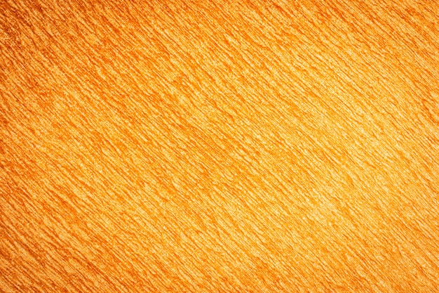 Superficie astratta e texuture delle trame di tessuto di cotone arancione