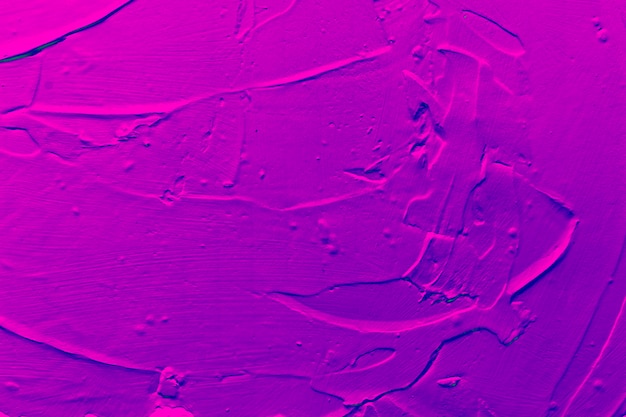 Abstract textured wall with purple paint