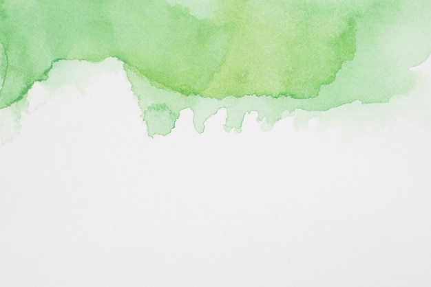 Abstract verdant spots of paints on white paper