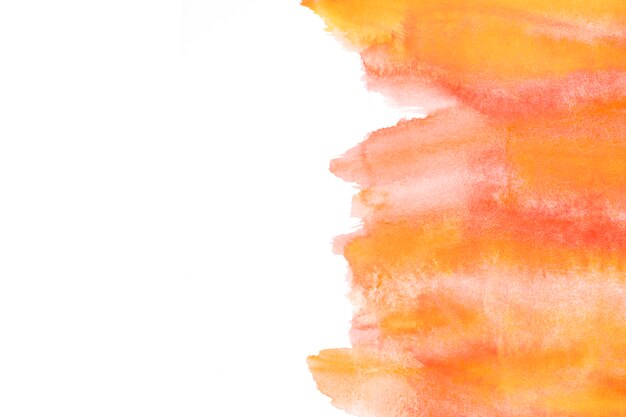 Abstract watercolor brush strokes over white paper