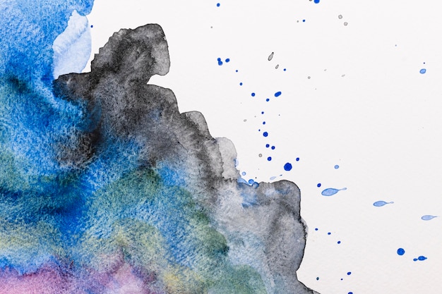 Free photo abstract watercolor ink splashes background