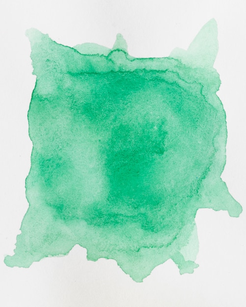 Abstract watercolour background with an emerald shade splatter of aquarelle paint