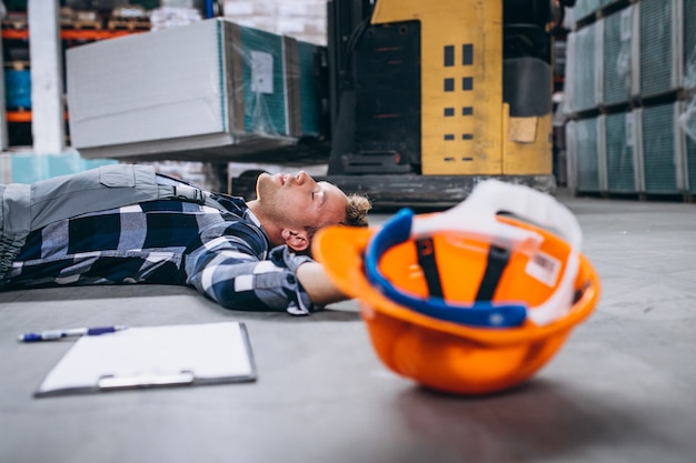 An accident at a warehouse, man on floor