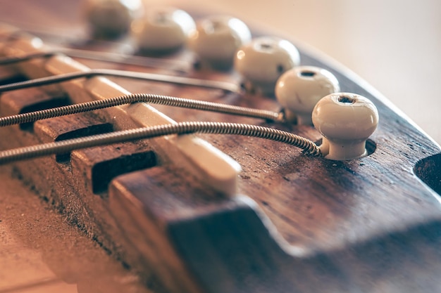 Acoustic guitar bridge and strings close up