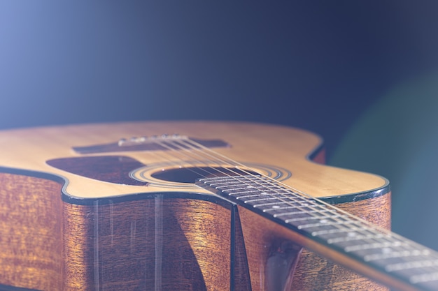 Free Photo | Beautiful grayscale shot of an acoustic guitar leaned on a ...