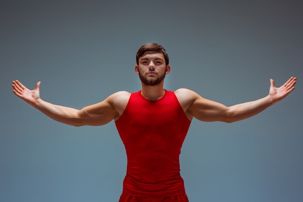 Free photo acrobatic man in red clothing
