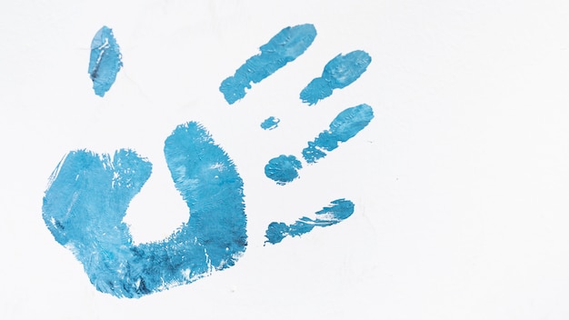 Acrylic blue human palm print isolated on white background