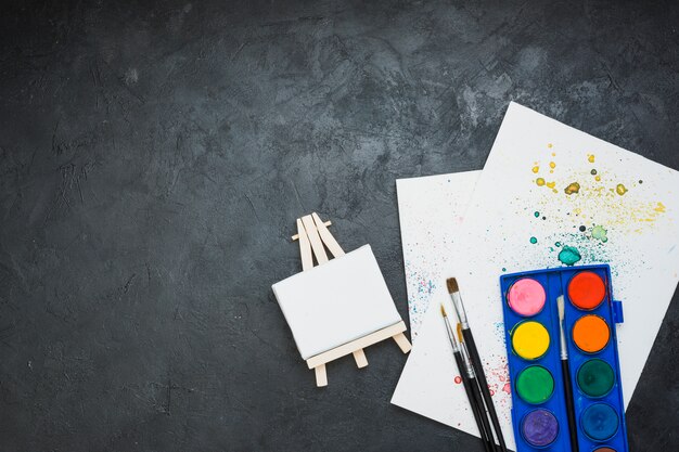 Acrylic painting equipment on black slate stone