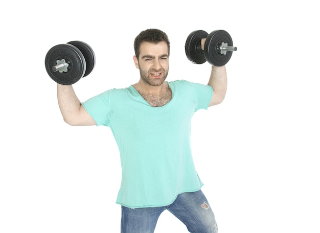 Active man with dumbbells and jeans