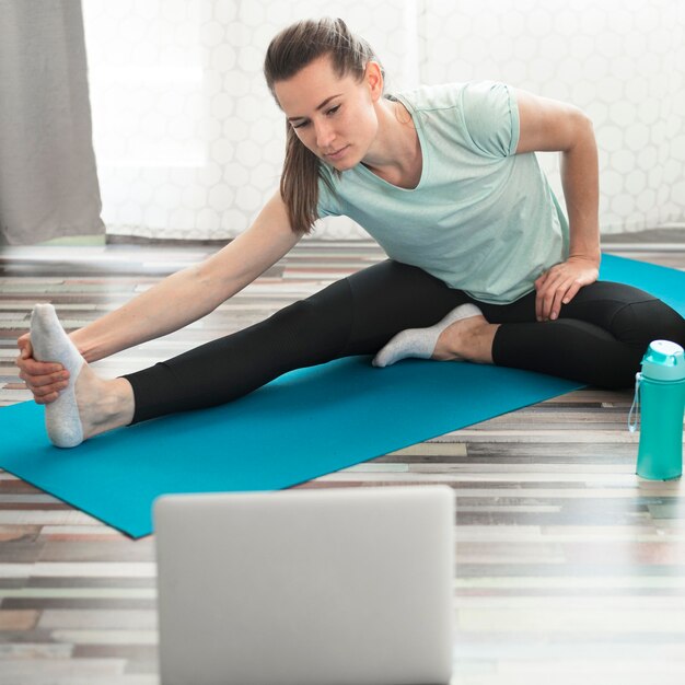 Active woman doing exercises at home