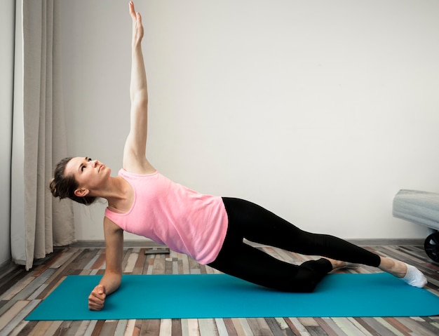 Active woman exercising at home