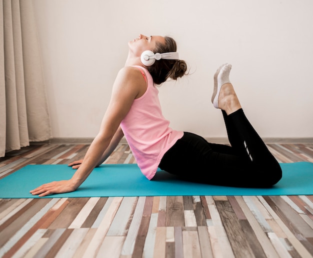 Free photo active woman stretching at home